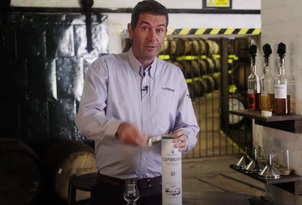 Man opening Laphroaig whiskey