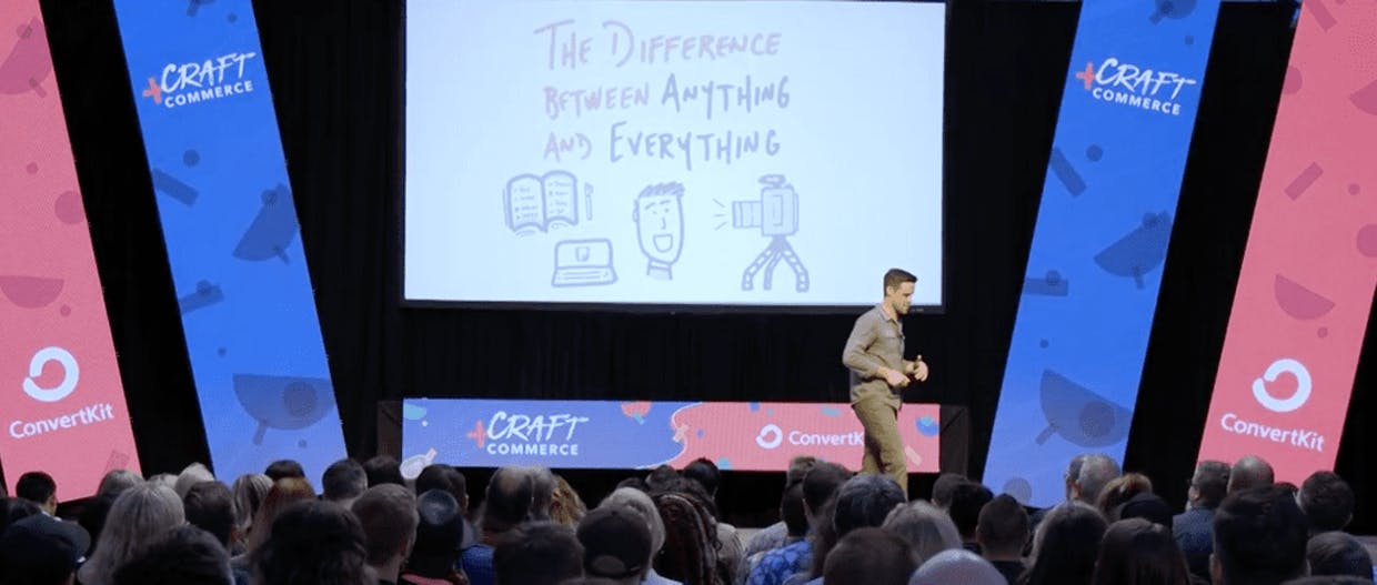 Man speaking on stage at a Craft + Commerce talk