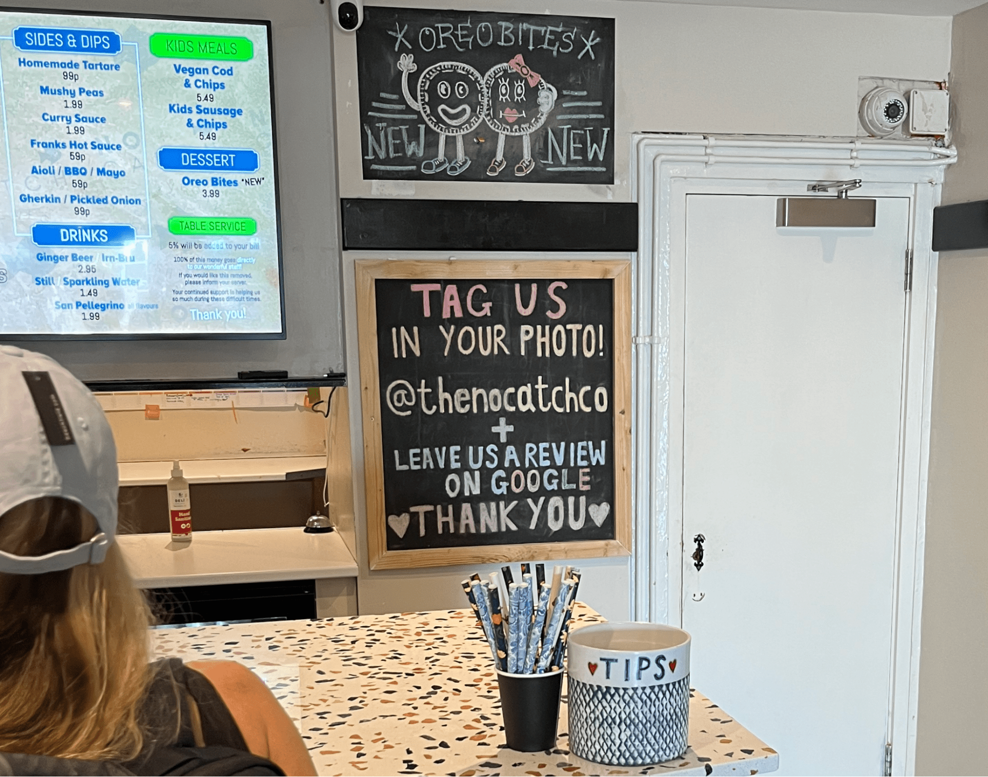 An restaurant encouraging reviews with a hand-made sign