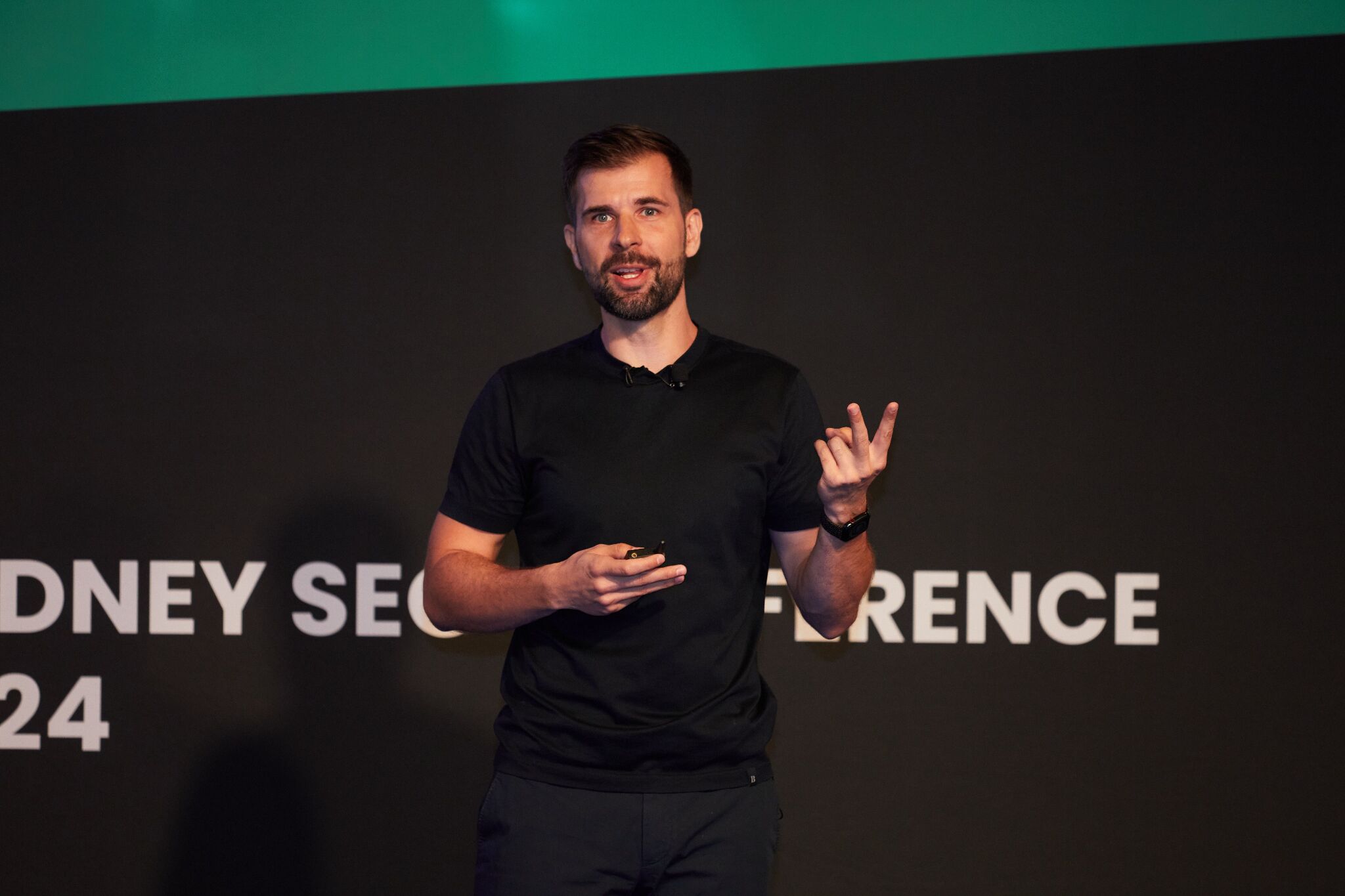 Tim Soulo presenting at Sydney SEO Conference on how to use Ahrefs for competitive intelligence.