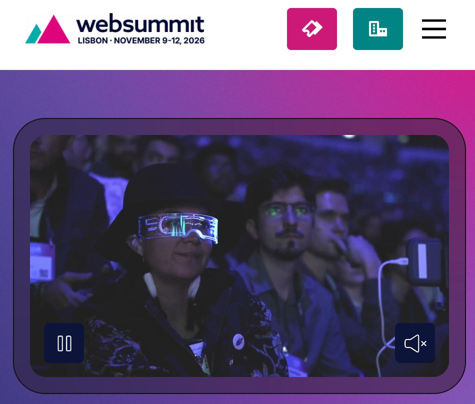 A video frame from Web Summit shows an audience member wearing futuristic glasses at a conference.