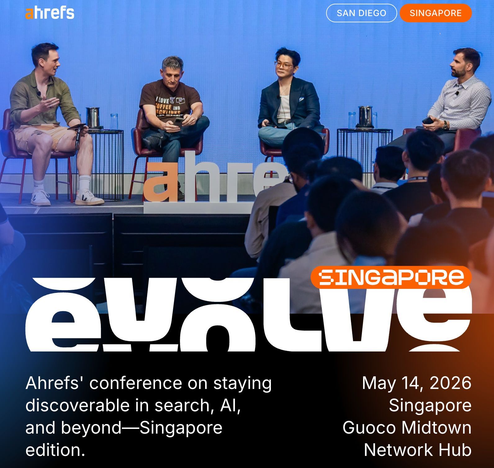 Ahrefs conference poster showing four men on stage for "Ahrefs Evolve" with date, location, and focus on AI.